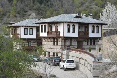 a house with cars parked in front of it at Leshtenski Perli in Leshten