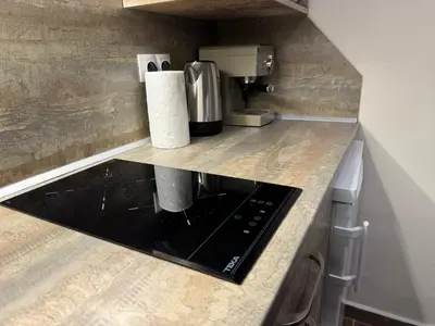 a kitchen with a counter top with a microwave at Borovets Gardens Chill Hill Studio by Joro in Borovets
