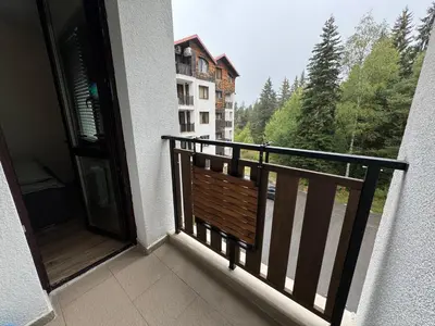 a balcony with a view of a building at Borovets Gardens Chill Hill Studio by Joro in Borovets