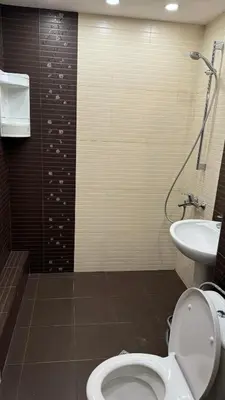 a bathroom with a toilet and a sink at Astoriq in Sofia