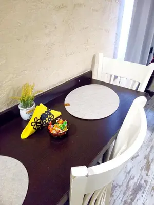 a black table with two white chairs and a bowl of candy at Apartment Lion's bridge 2 - Top Center in Sofia