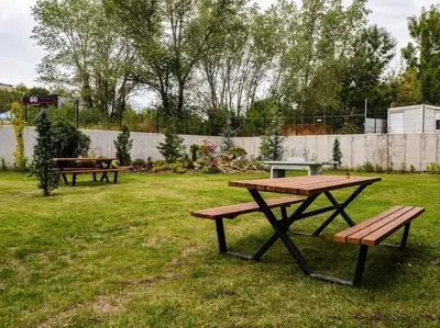 a picnic table and benches in a yard at My Campus 1 bdrm, Mountain view, Free parking, Self check-in in Sofia