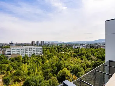 an apartment balcony with a view of trees and buildings at My Campus 1 bdrm, Mountain view, Free parking, Self check-in in Sofia