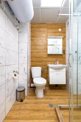 a bathroom with a toilet and a sink at Bright and Cozy Apartment Next to a City Park by Flat Mаnager in Plovdiv