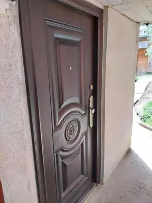 a wooden door in a hallway at Independent studio in a house in the city in Sofia