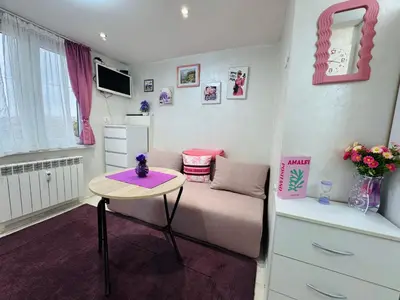 a small living room with a couch and a table at Central Art Studio in Sofia