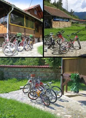 a group of bikes parked in front of a building at Ski liviomoritz at gma il com Chalet in Madzhare