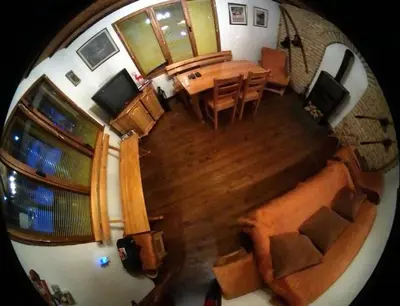 an overhead view of a living room with a table and chairs at Ski liviomoritz at gma il com Chalet in Madzhare