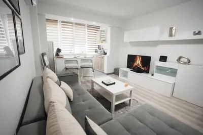 a living room with a couch and a table at The Secret Paradise in Sofia