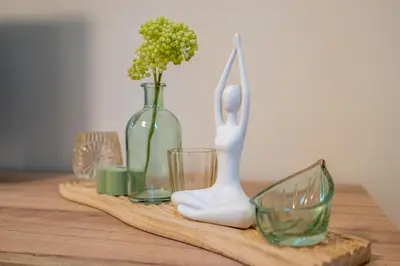 a table with vases and a white statue and glasses at The Secret Paradise in Sofia
