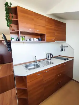 a kitchen with wooden cabinets and a sink at 