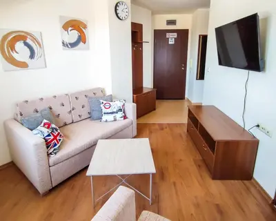 a living room with a couch and a tv at 
