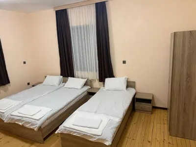 two beds in a room with a window at Къща за гости Савана, Пловдив,Plovdiv, летище Пловдив, Plovdiv Airport,Ягодово in Yagodovo