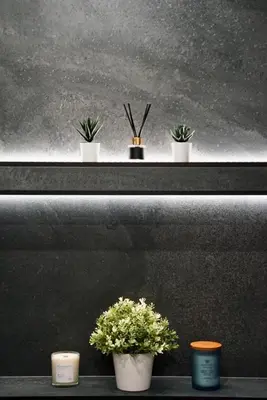 three potted plants sitting on a shelf at AveNew Luxury Apartment 3 in Sofia
