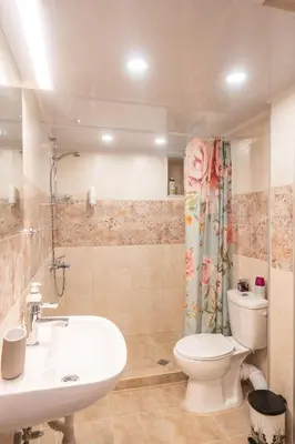a bathroom with a white toilet and a sink at Casa Lavandula in Sredno Gradishte