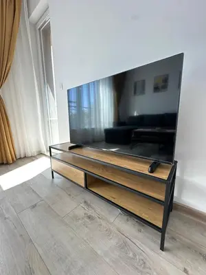 a living room with a large mirror on the wall at 1BD Flat near Maritsa river and City Center in Plovdiv