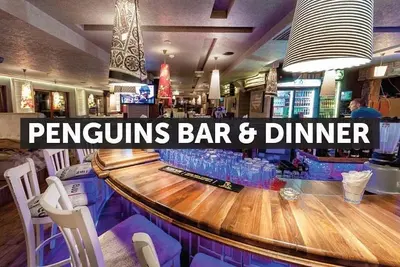 a bar with a wooden counter in a restaurant at ТОП Локация и УЮТ in Bansko
