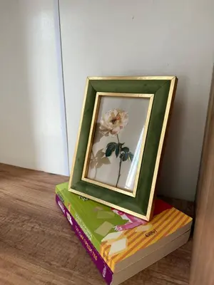 a picture of a flower on top of a box at Center Apartments The Quiet Luxury 1 in Plovdiv