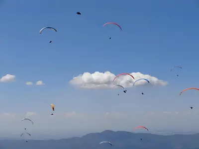 a group of kites flying in the sky at Къща за гости Casa La Tinozza in Hisarya