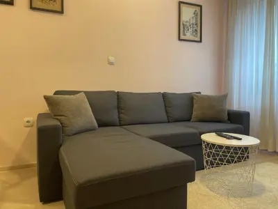 a living room with a couch and a table at 2BR Apartment Near Gondola by SI Stay in Bansko