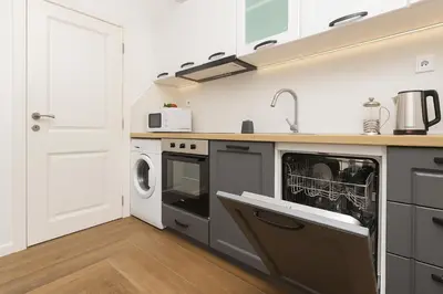 a kitchen with a sink and a dishwasher at Cozy and comfortable northern apartment, Kapana district, Plovdiv, Center in Plovdiv