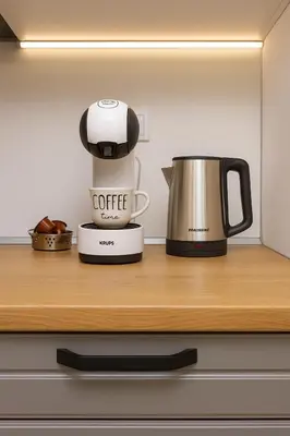a coffeemaker and a coffee maker on a shelf at Cozy and comfortable southern apartment, Kapana district, Plovdiv, Center in Plovdiv