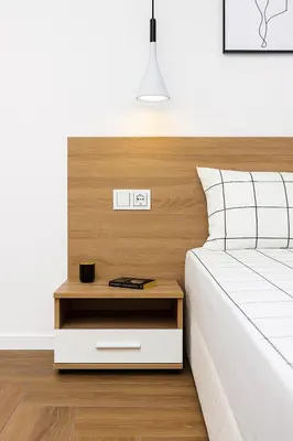 a bedroom with a bed with a nightstand next to it at Cozy and comfortable southern apartment, Kapana district, Plovdiv, Center in Plovdiv