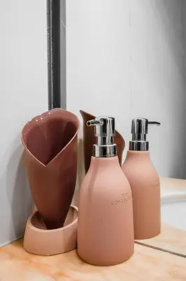 two bottles of soap and a bowl on a counter at Best Views from Top Central Cozy 1-Bedroom Flat by Flat Mаnager in Sofia