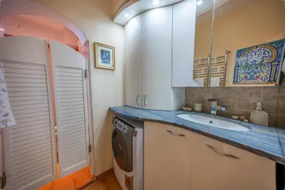 a kitchen with a sink and a washing machine at Spacious 3-BR Central Retreat in Sofia