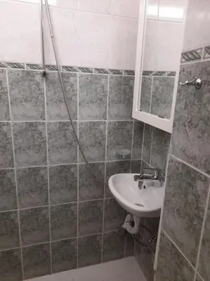 a bathroom with a sink and a mirror at The Cathedral in Sofia