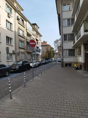 a street with a do not enter sign and buildings at The Cathedral in Sofia