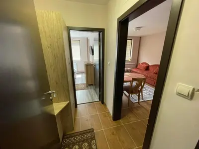 a hallway with a door leading to a living room at Комплекс Свети Георги in Pamporovo