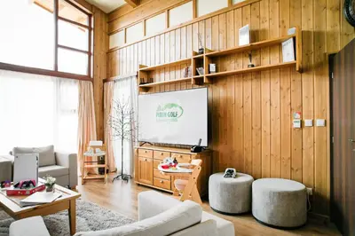 a living room with a chalkboard and a screen at Pirin Golf Villa Relax in Razlog