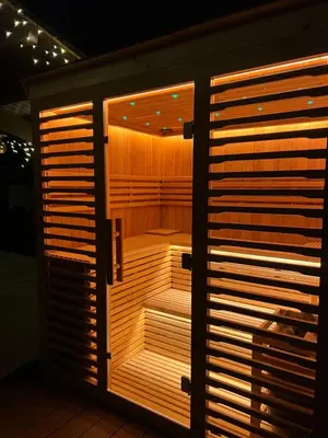an empty sauna in a room with wooden shutters at Pirin Golf Villa Relax in Razlog