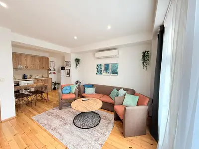 a living room with a couch and a table at Central 2 Bedroom Apartments The Quiet Luxury 3 in Plovdiv