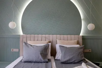 a bedroom with a bed with two pillows at NEW Glamours Central Suite with Elevator in Sofia