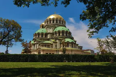 a building with a gold dome on top of it at Central And Spacious Home in Sofia