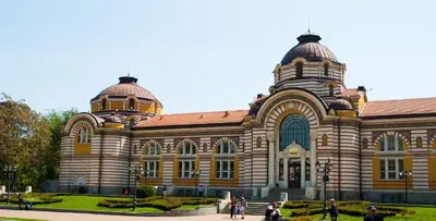 a large building with people walking in front of it at Central And Spacious Home in Sofia