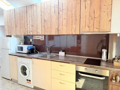 a kitchen with a sink and a washing machine at Center Apartments The Quiet Luxury 6 in Plovdiv