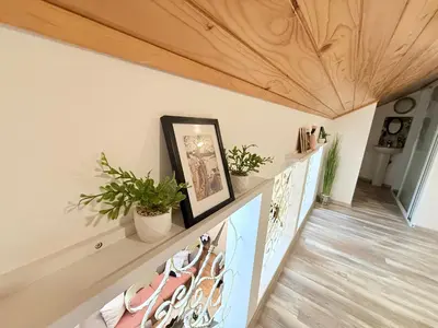 a hallway with white walls and a wooden ceiling at Center Apartments The Quiet Luxury 7 in Plovdiv
