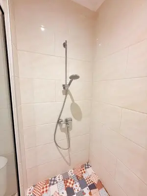 a shower with a shower head in a bathroom at Central 2 Bedroom Apartments The Quiet Luxury 8 in Plovdiv