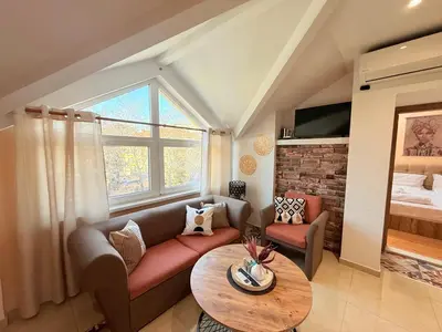 a living room with a couch and a table at Central 2 Bedroom Apartments The Quiet Luxury 8 in Plovdiv