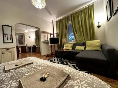 a living room with a bed and a couch at Cultural Retreat in Sofia in Sofia
