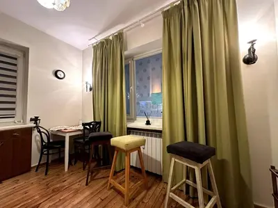 a room with a table and chairs and a window at Cultural Retreat in Sofia in Sofia