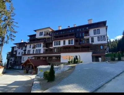 a large building with a parking lot in front of it at 