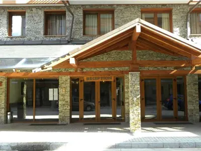 a building with awning on the front of it at Studio Todorka in Bansko