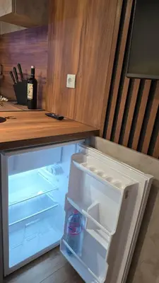 a refrigerator with its door open in a kitchen at Studio Todorka in Bansko