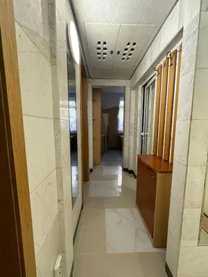 a hallway in a building with a hallway at Venelin Apartment in Sofia