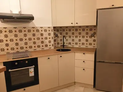 a kitchen with white cabinets and a sink at My place in Sofia - Top center - 2 bedrooms - Self check-in in Sofia