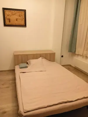 a small bed in a small room with at My place in Sofia - Top center - 2 bedrooms - Self check-in in Sofia
